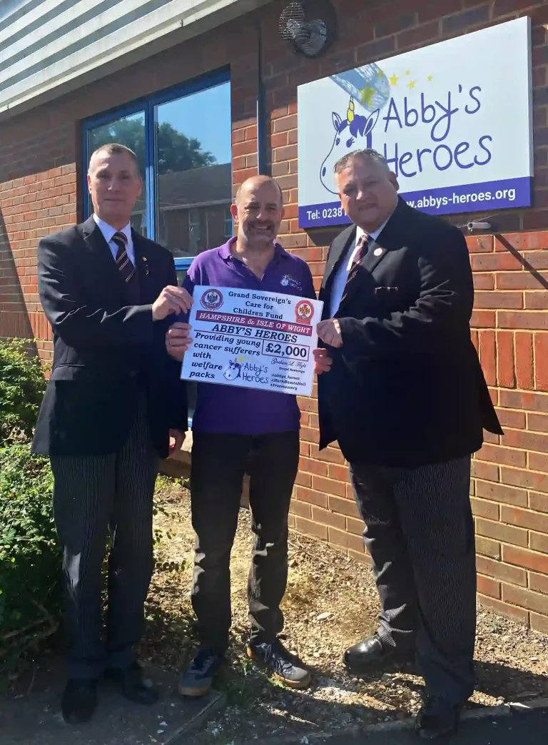 R.Ill.Kt. Steven Groeger (Intendant General) and Ill.Kt. Mark Denton (Deputy Intendant General) presenting a cheque for £2000 from the Grand Sovereign's Care for Children Fund to David Fawcett from Abby's Heroes.