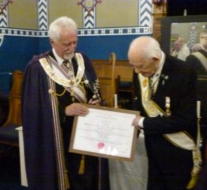 V.Ill.Kt. Malcolm Slater receiving his 50 year certificate