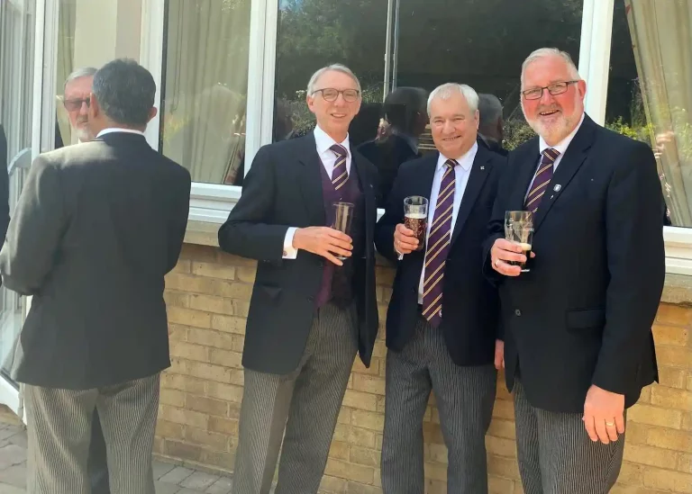 More guests enjoying drink in the sunshine.